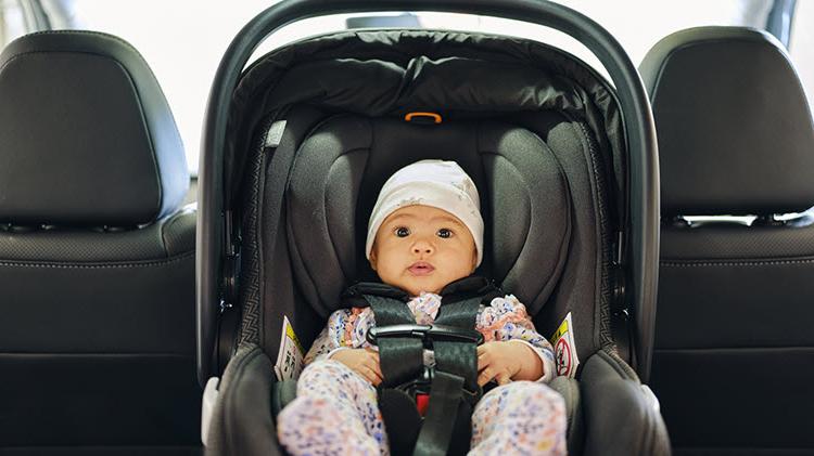 Baby in a car seat.