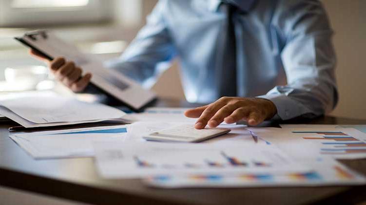 Man looking at his financial portfolio.